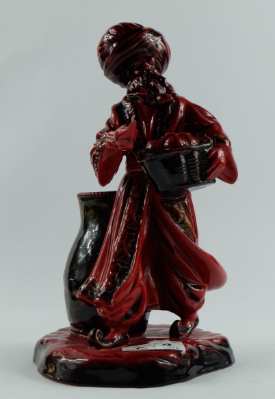 Appraisal: Royal Doulton flambe figure The lamp Seller HN