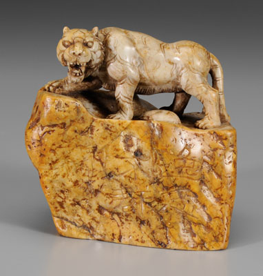 Appraisal: Chinese softstone seal mottled gray with an amber skin carved