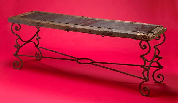 Appraisal: A rustic wrought metal and wood console table comprised of