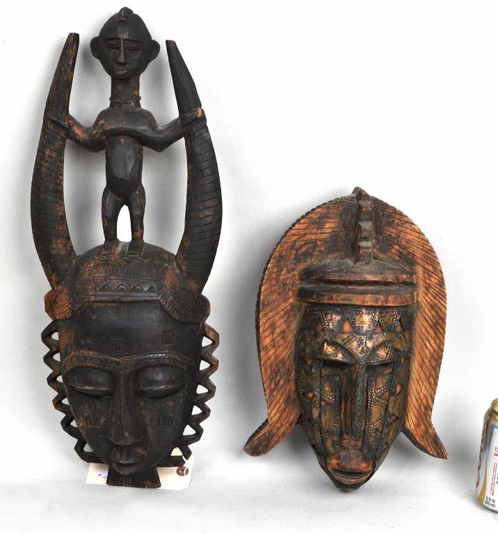 Appraisal: Two African Carved Wood Masks the smaller with applied metal