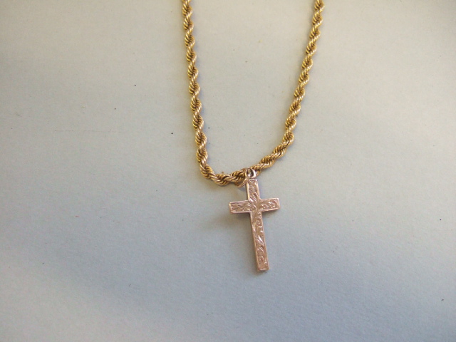 Appraisal: A ct gold pendant cross with scroll engraved decoration Birmingham