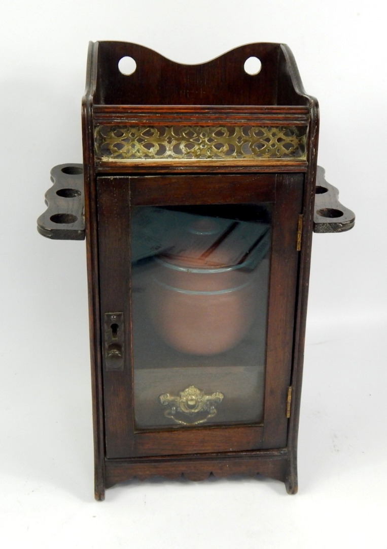 Appraisal: A Victorian oak smoker's cabinet with a galleried top folding