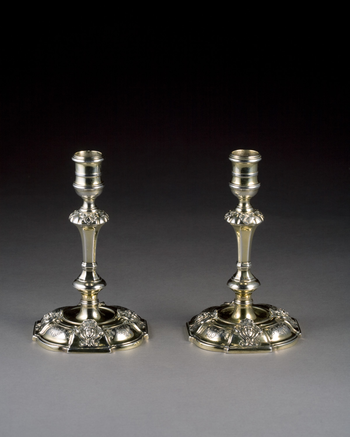 Appraisal: PAIR OF GEORGE II CAST SILVER-GILT CANDLESTICKS JAMES GOULD LONDON