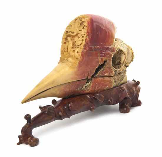 Appraisal: A Carved Hornbill Skull having relief carving at the front