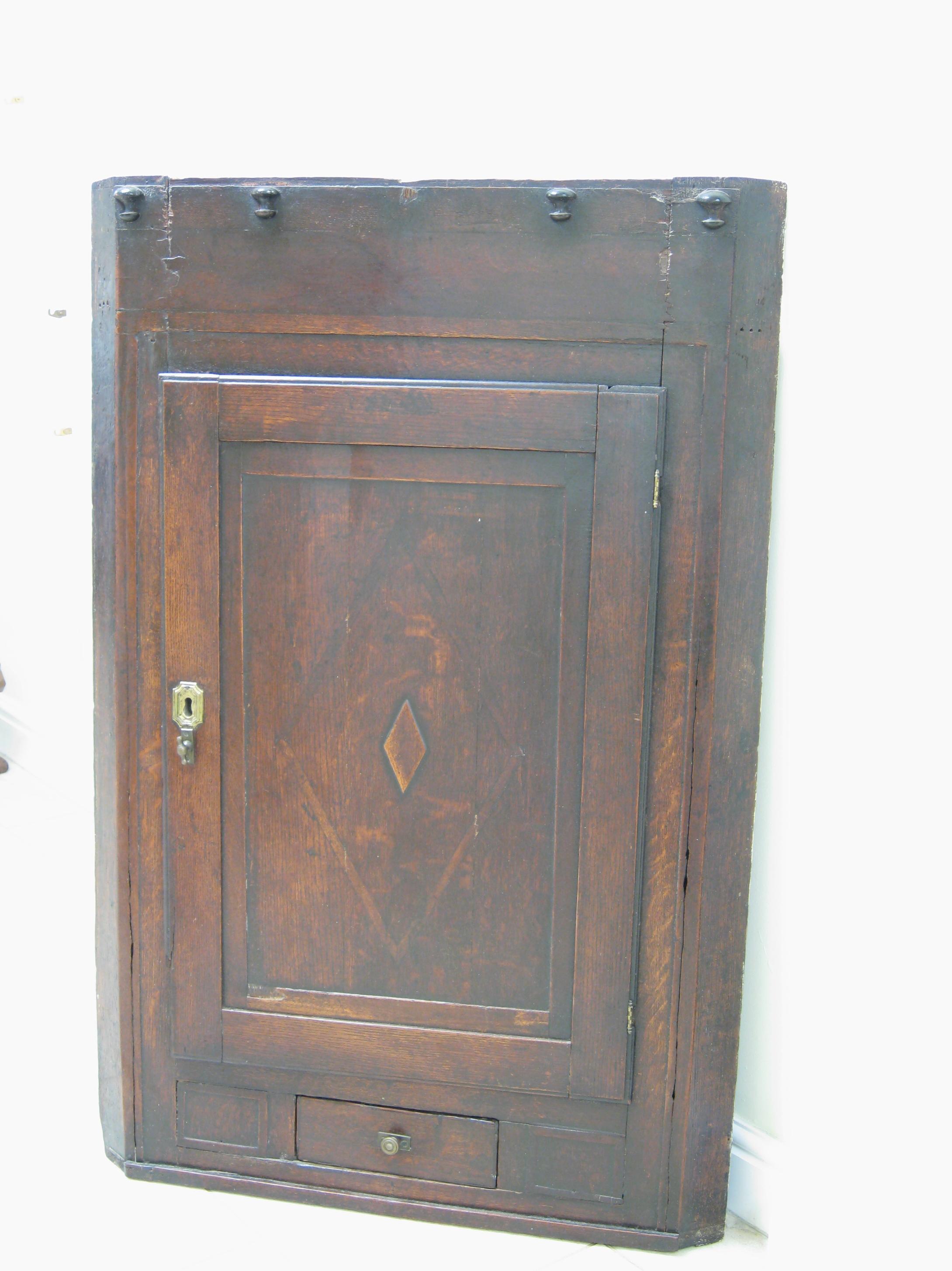 Appraisal: A Georgian oak Corner Cupboard with single drawer