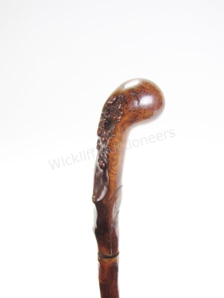 Appraisal: Toledo Sword Cane natural tree branch shaft and carved handle