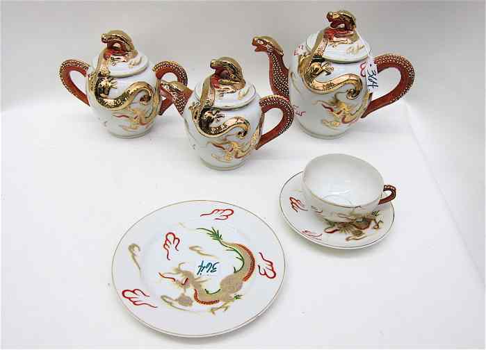 Appraisal: PIECE ORIENTAL HAND ENAMELED DESSERT SET with dragon design lithopane