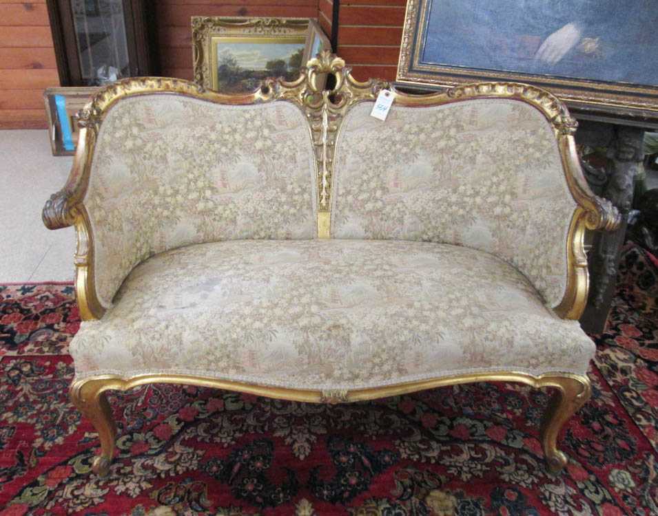 Appraisal: LOUIS XV STYLE CARVED AND MOLDED GILTWOOD SETTEE American th