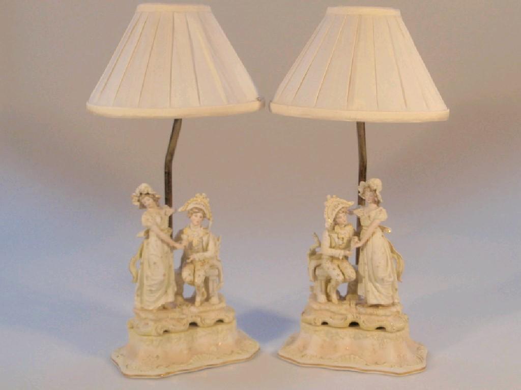 Appraisal: A pair of continental bisque lamps each with a costume