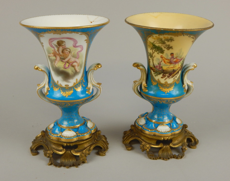 Appraisal: A pair of thC Sevres style two handled urns each