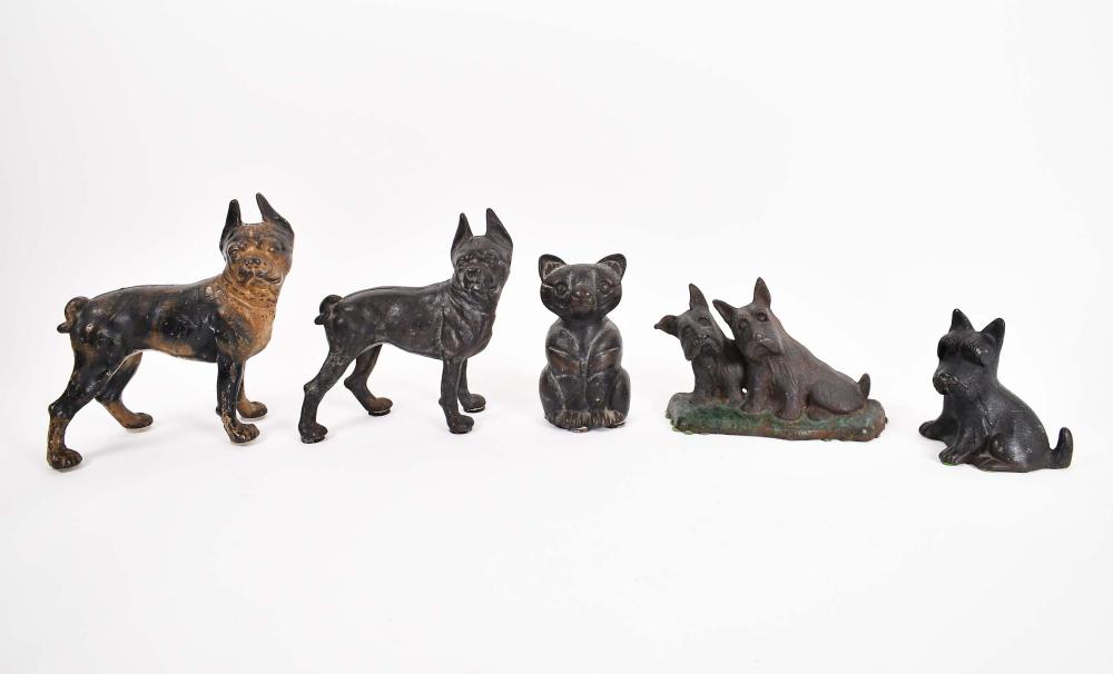 Appraisal: FIVE CAST IRON DOG AND CAT DOORSTOPSAmerican English to Four