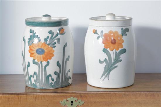 Appraisal: TWO POTTERY JARS Each with lids and floral decoration Unmarked