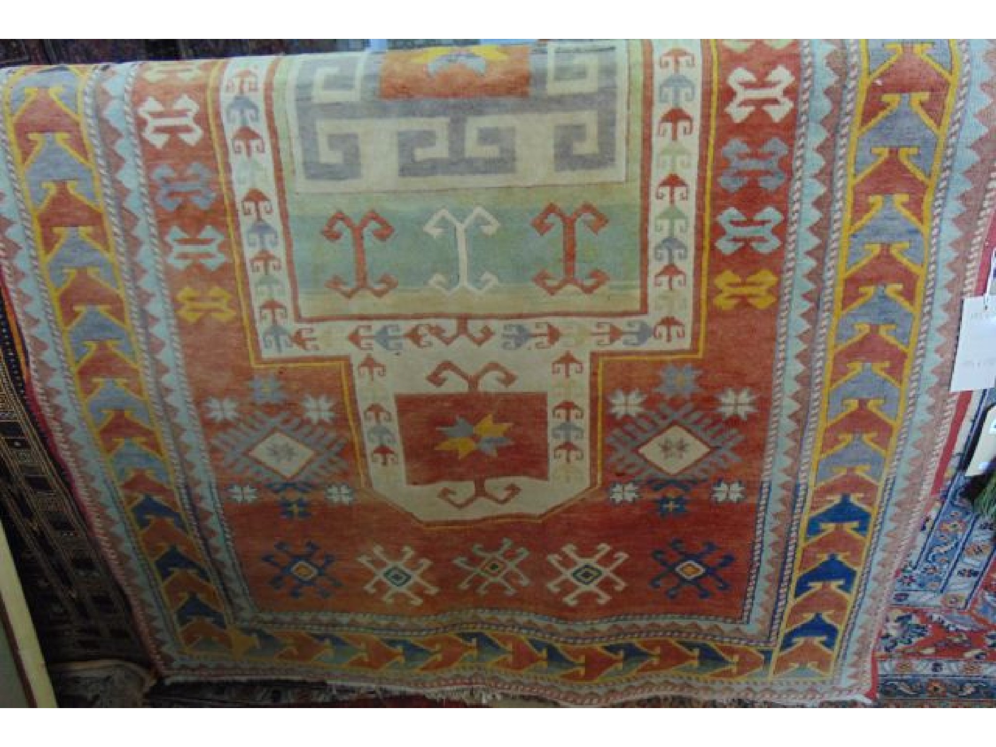 Appraisal: A Turkey wool carpet in pastel shades geometric detail and