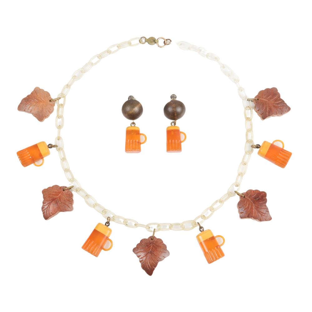 Appraisal: BAKELITE AND WHITE CELLULOID NECKLACE AND EARRINGS WITH BEER STEIN