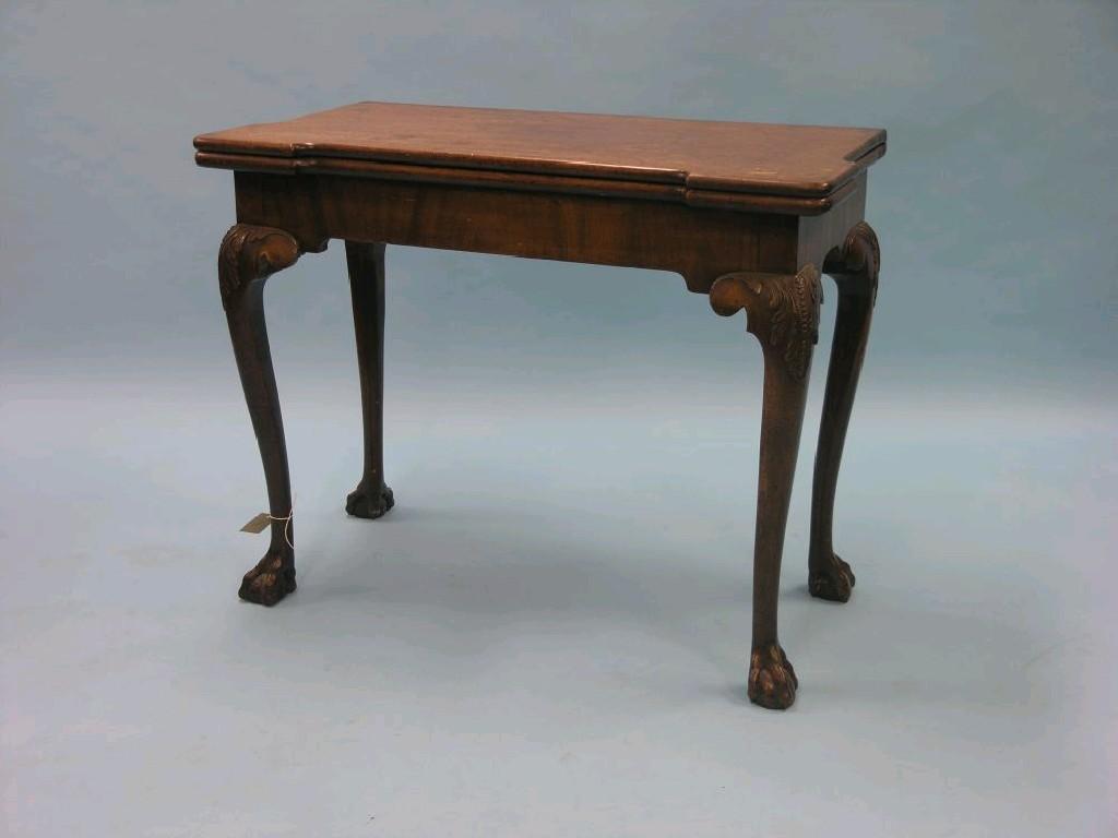 Appraisal: A Chippendale-period mahogany card table hinged rectangular top above frieze