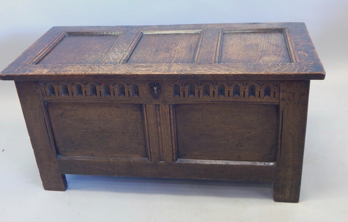 Appraisal: A late thC panelled oak coffer cm wide