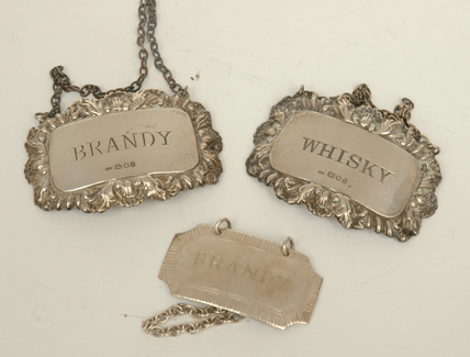 Appraisal: A GROUP OF THREE STERLING SILVER DECANTER LABEL