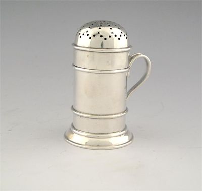 Appraisal: A kitchen pepper with domed cover and scroll handle the