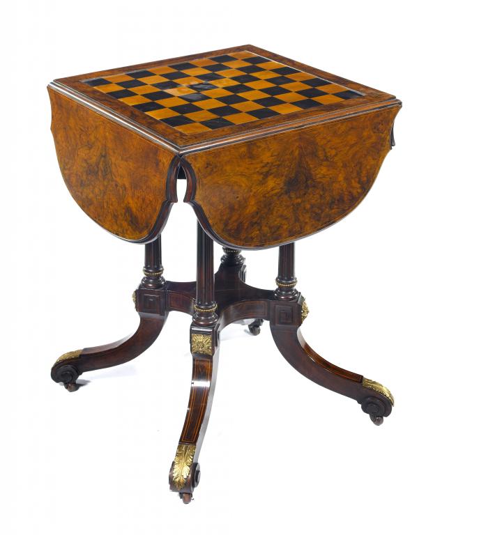 Appraisal: A VICTORIAN WALNUT GAMES TABLE the reversible line inlaid square