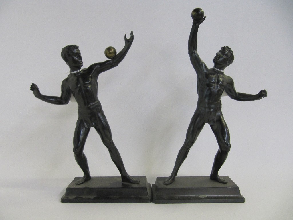 Appraisal: Pair of Classical male figures each with a gilded ball