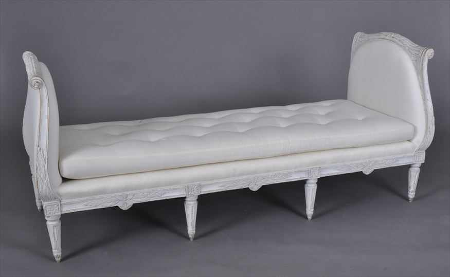 Appraisal: SWEDISH NEOCLASSICAL CARVED AND WHITE PAINTED LIT D'ALCOVE The padded