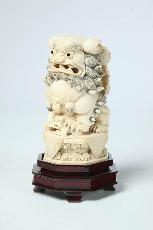 Appraisal: IVORY CARVING Asian th century Foo dog on octagonal base