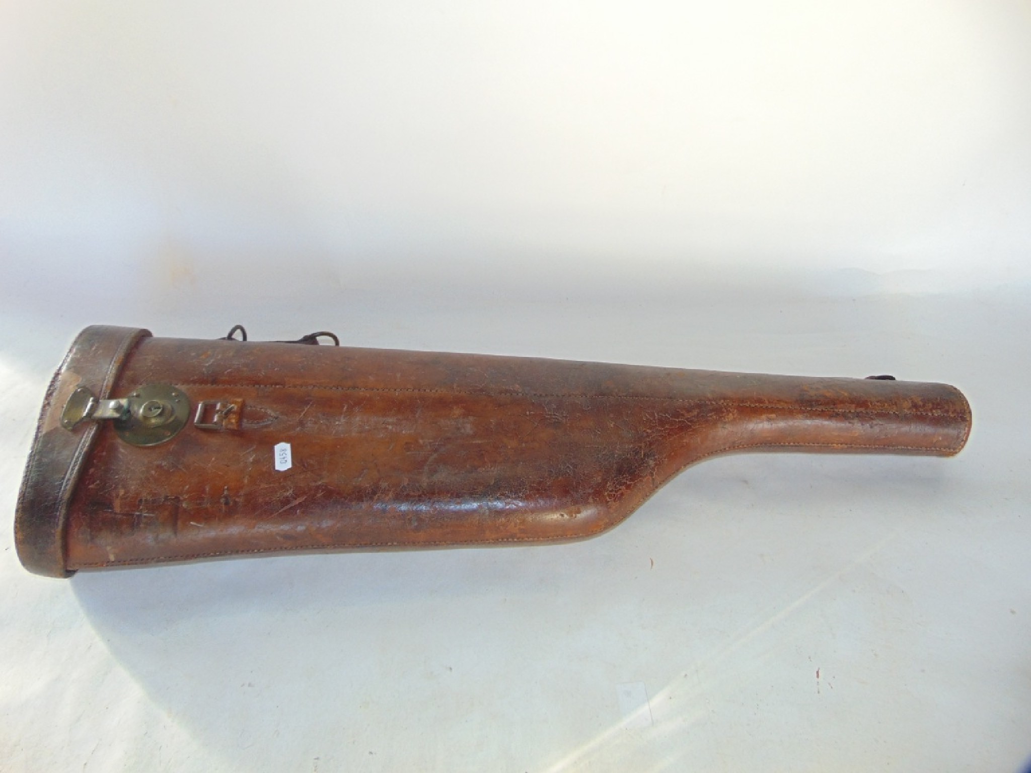 Appraisal: An antique stitched leather Leg of Mutton type gun case