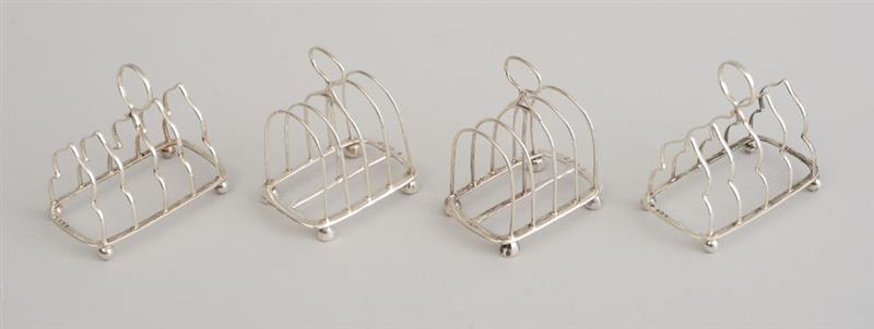 Appraisal: TWO PAIRS OF ENGLISH SILVER TOAST RACKS William Comyns London