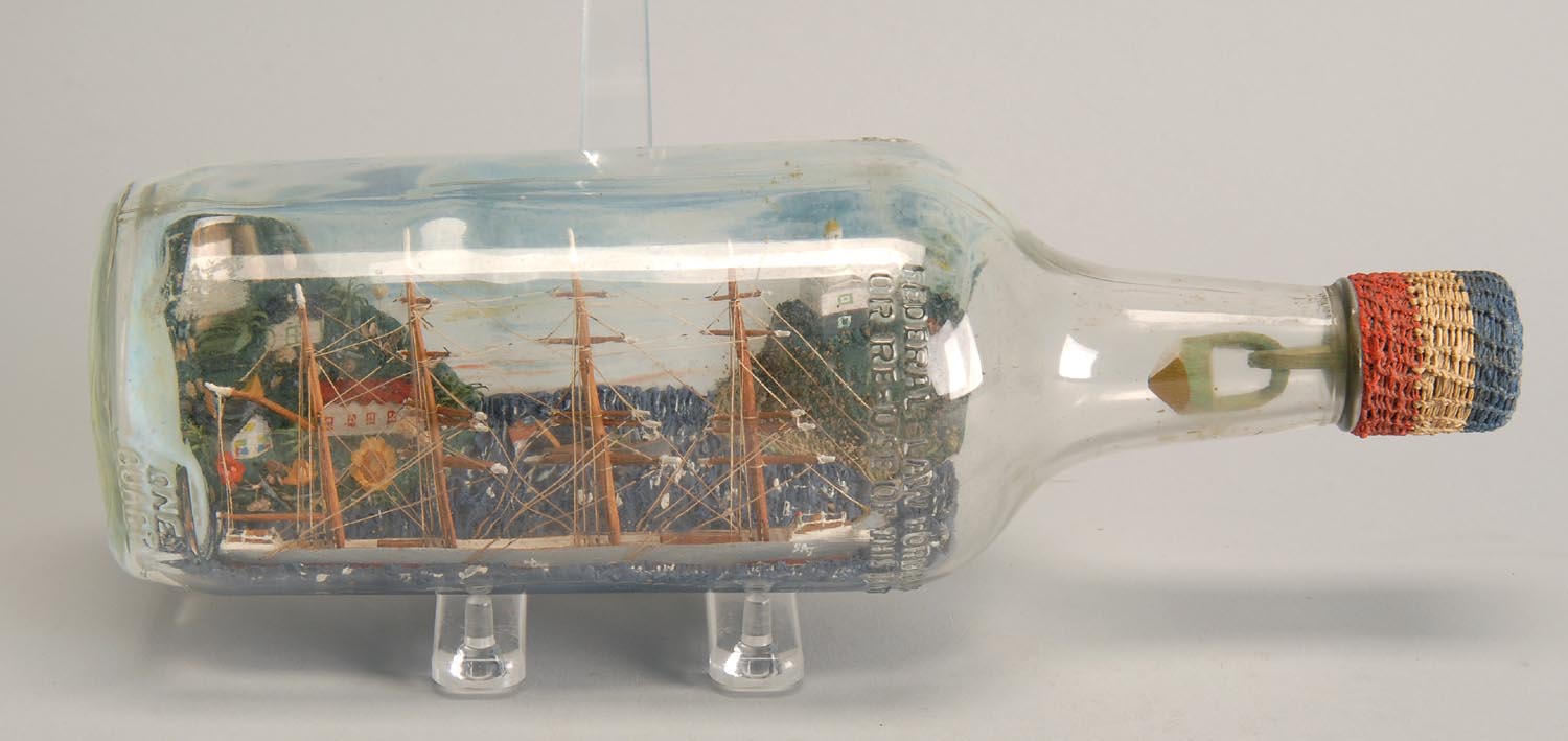 Appraisal: SHIP IN A BOTTLE Early th CenturyFour-masted sailing ship with