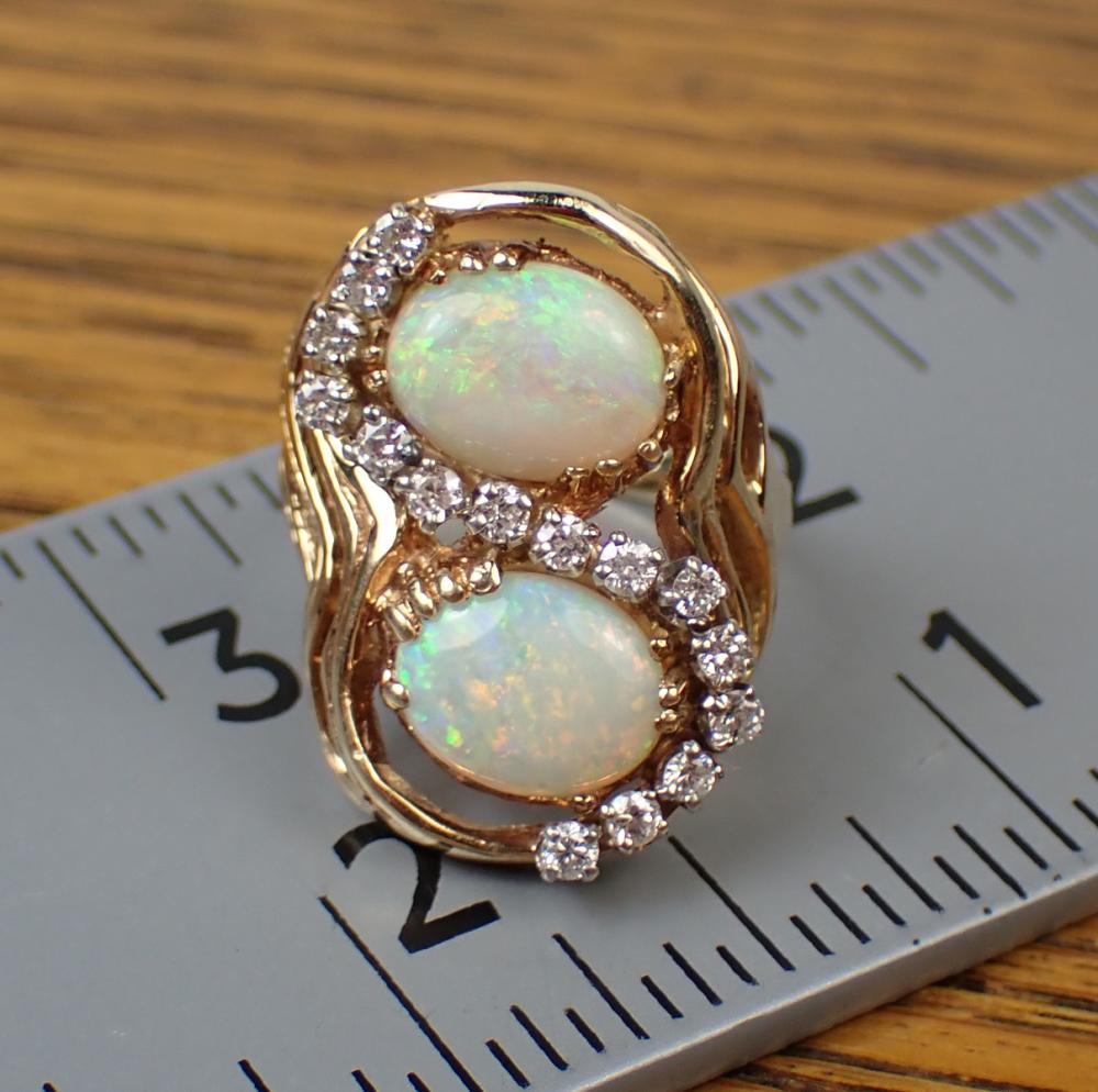 Appraisal: OPAL DIAMOND AND FOURTEEN KARAT GOLD RING with round full-cut