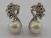 Appraisal: Bucherer A pair of diamond and cultured pearl clip earrings