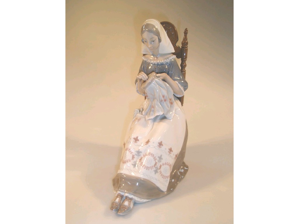 Appraisal: A Lladro porcelain figure of a seated woman with an