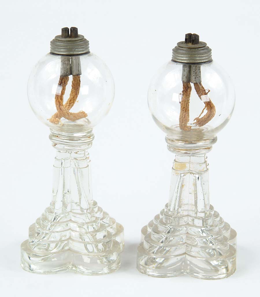 Appraisal: PAIR OF EARLY GLASS WHALE OIL LAMPS Round globe like