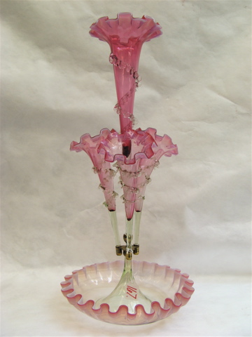 Appraisal: AN AMERICAN VICTORIAN CRANBERRY GLASS EPERGNE having one long and