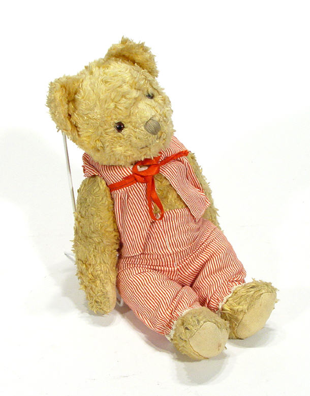 Appraisal: Old jointed golden teddy bear in pyjamas cm high