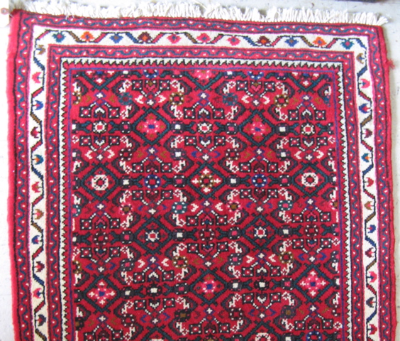 Appraisal: PERSIAN RUNNER overall Heratif floral decoration on red ground hand