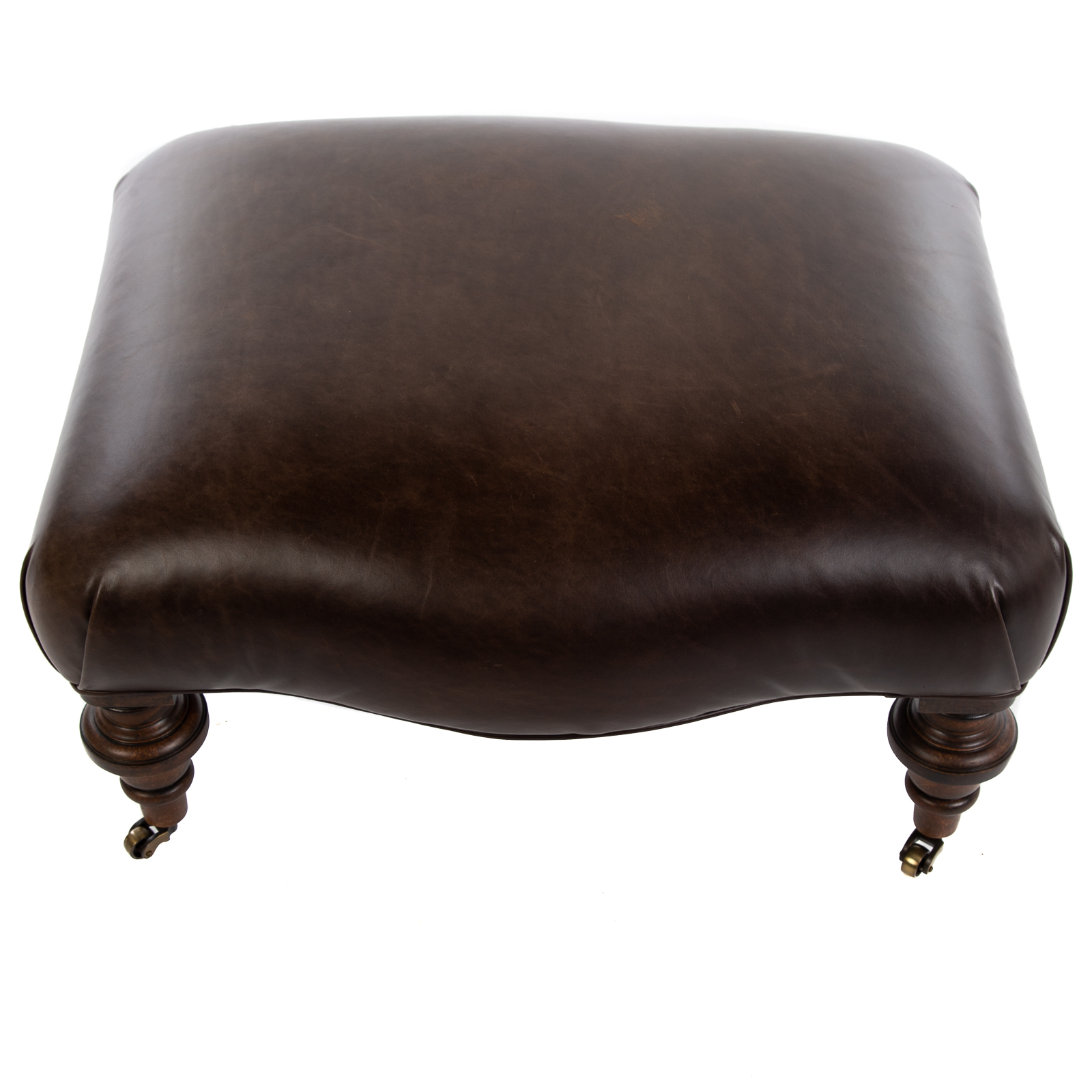 Appraisal: VICTORIAN STYLE LEATHER OTTOMAN th century shaped ottoman with brown