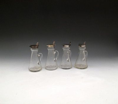 Appraisal: A set of four silver mounted glass whisky tots by