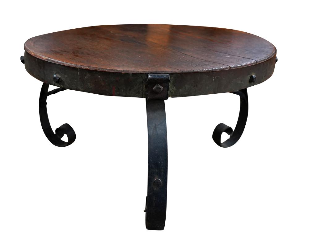 Appraisal: IRON BASE WOOD COFFEE TABLECondition with large split to wood