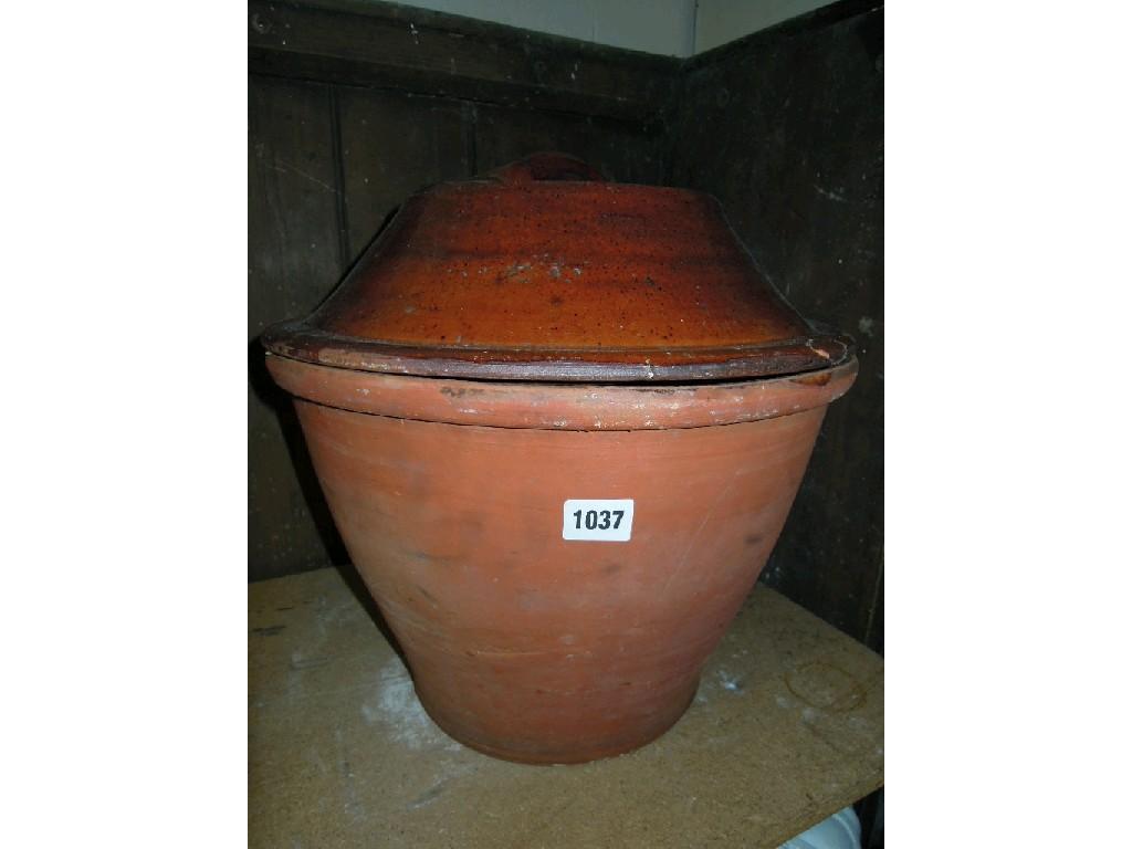 Appraisal: A terracotta preserve pan and associated glazed cover