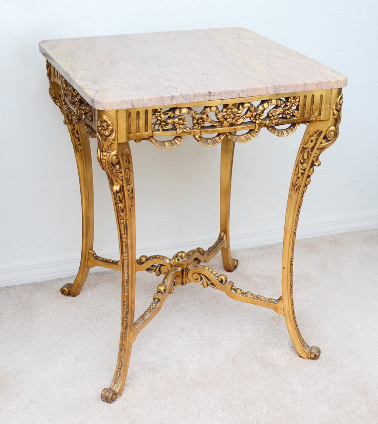 Appraisal: CARVED GILT WOOD MARBLE TOP SIDE TABLE Pink variegated marble