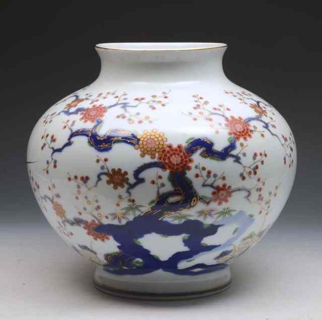 Appraisal: A JAPANESE WHITE GROUND BALUSTER VASE with underglaze blue and