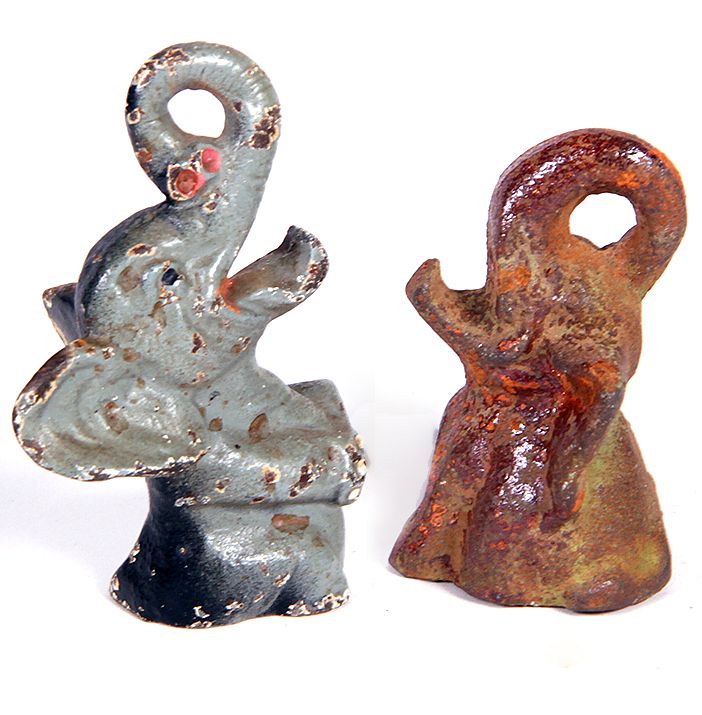 Appraisal: Cast Iron Bottle Openers A pair of cast iron elephant