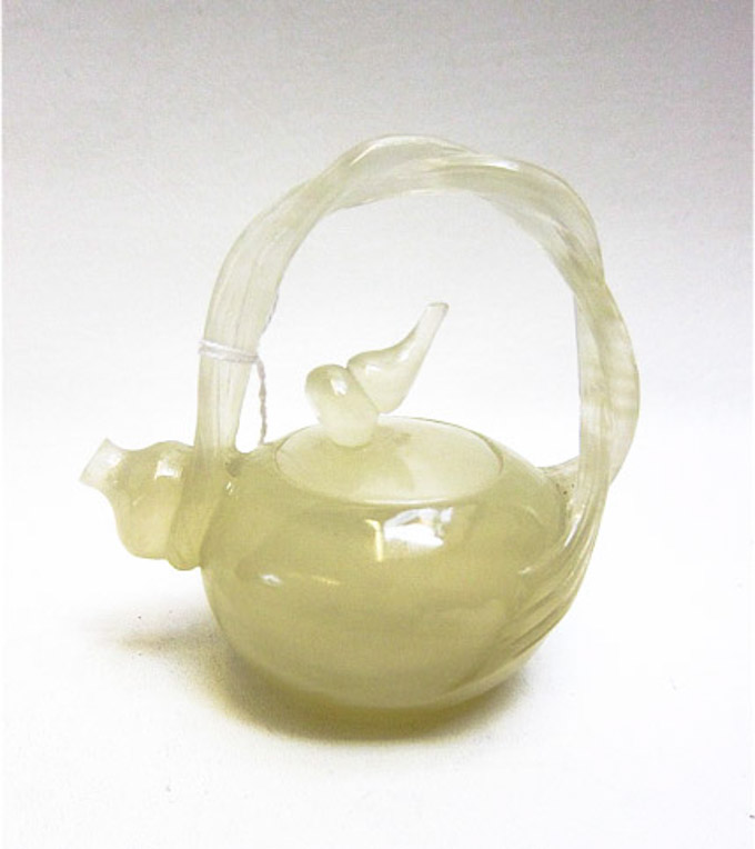 Appraisal: CHINESE MINIATURE JADE TEAPOT translucent light green jade with round