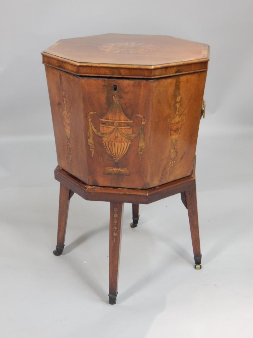 Appraisal: A thC mahogany and marquetry cellarette the octagonal top enclosing