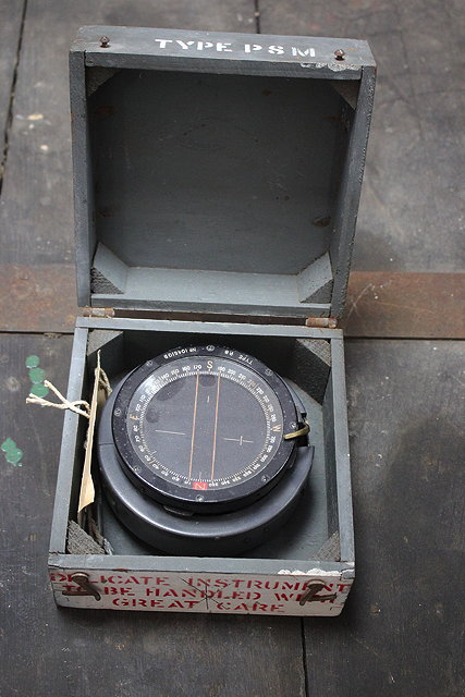 Appraisal: A WORLD WAR II BUBBLE COMPASS in grey painted pine