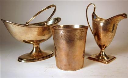 Appraisal: Three Georgian sterling silver table articlesComprising a swing-handled sugar bowl