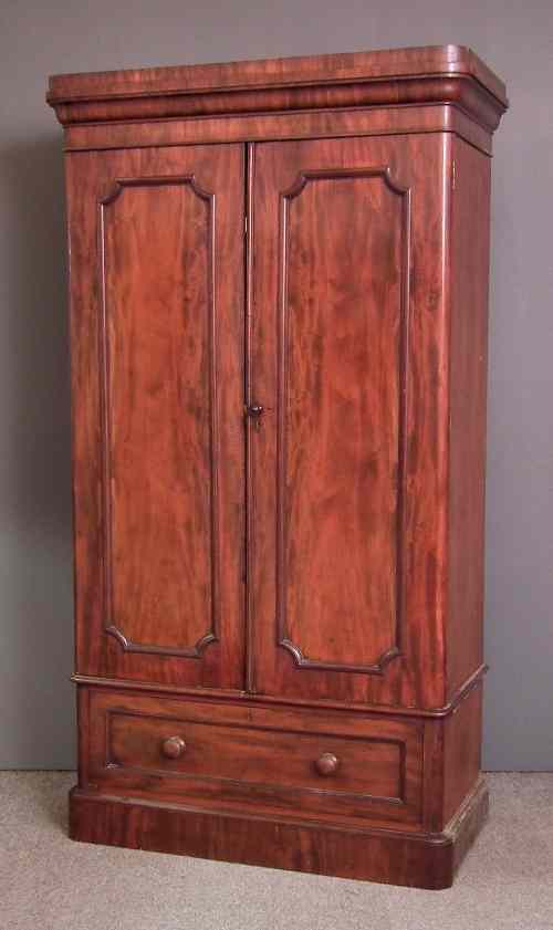 Appraisal: A Victorian mahogany wardrobe with rounded front corners the top