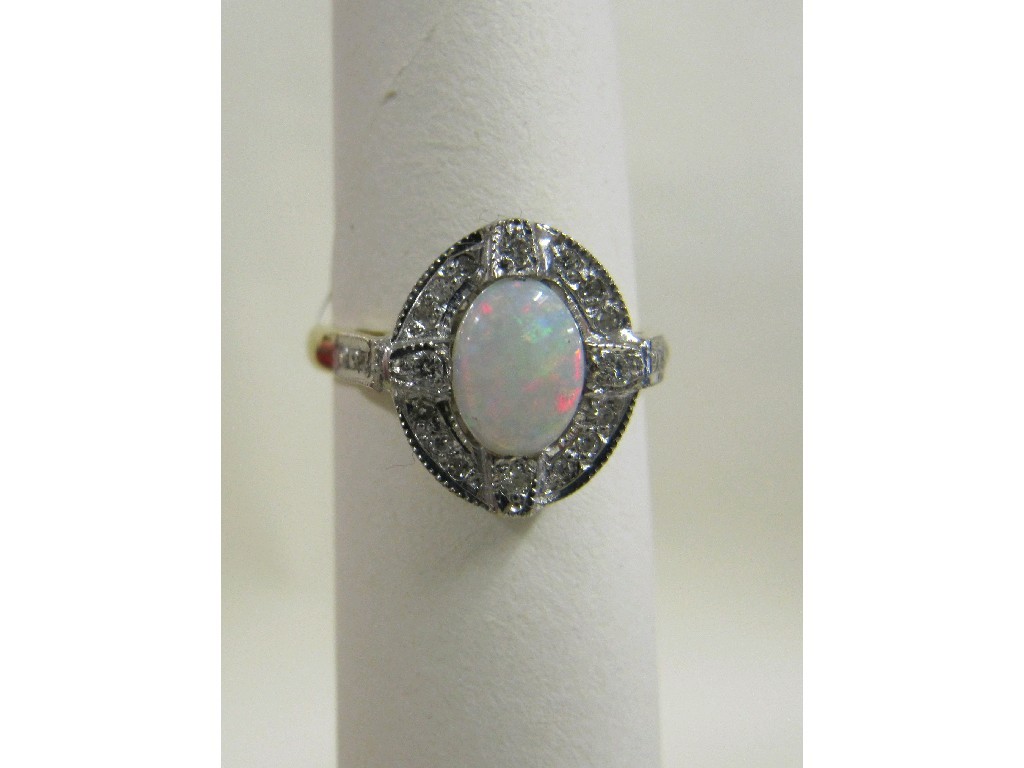 Appraisal: Eighteen carat gold opal and diamond set dress ring