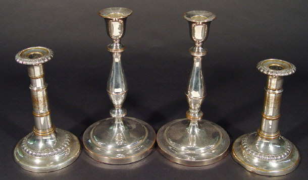 Appraisal: Two pairs of circular based silver plated candlesticks one pair